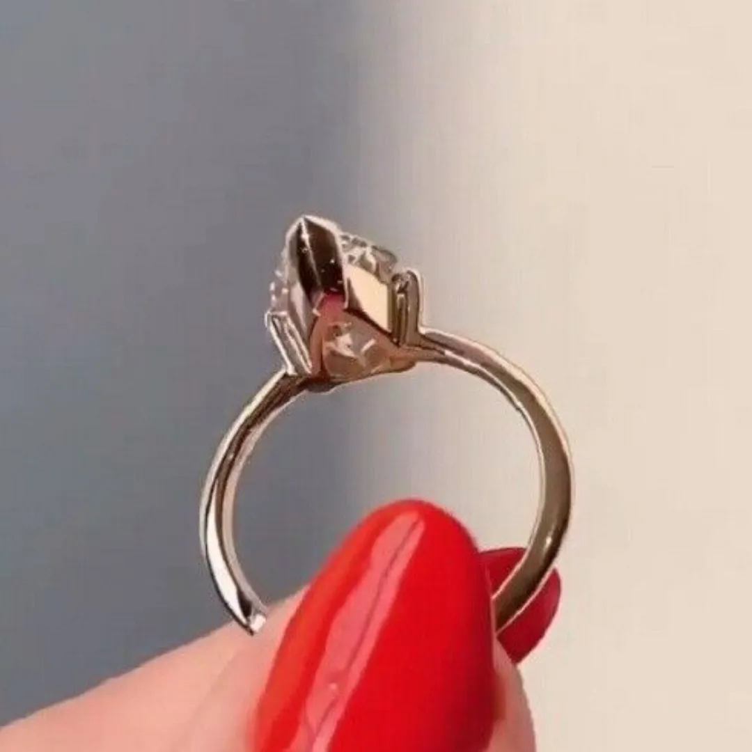 /public/photos/live/Crushed Ice Pear Cut Singular Moissanite Ring 666 (5).webp